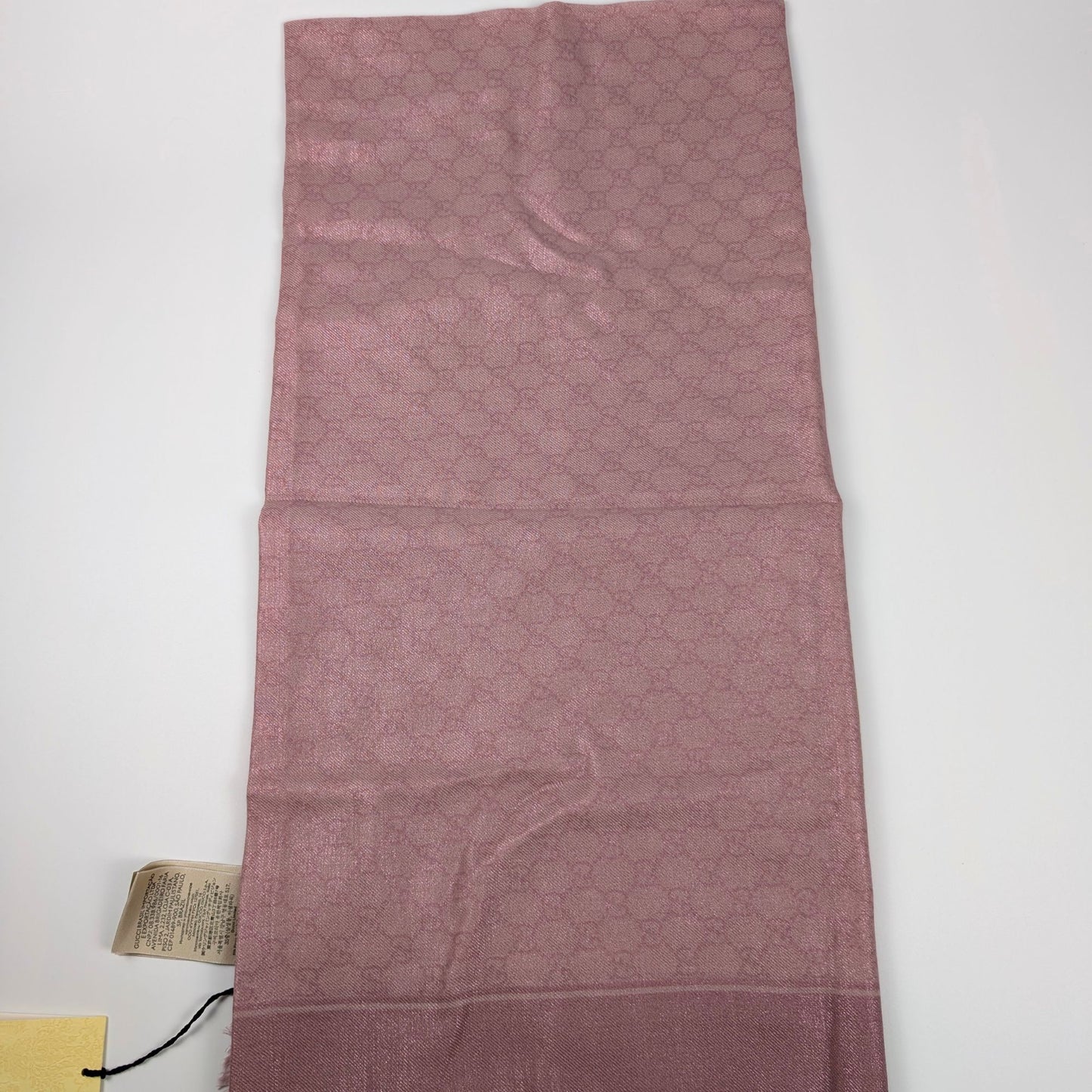 Scialle Gucci in lana GG jacquard rosa lucido piegato con cartellino originale